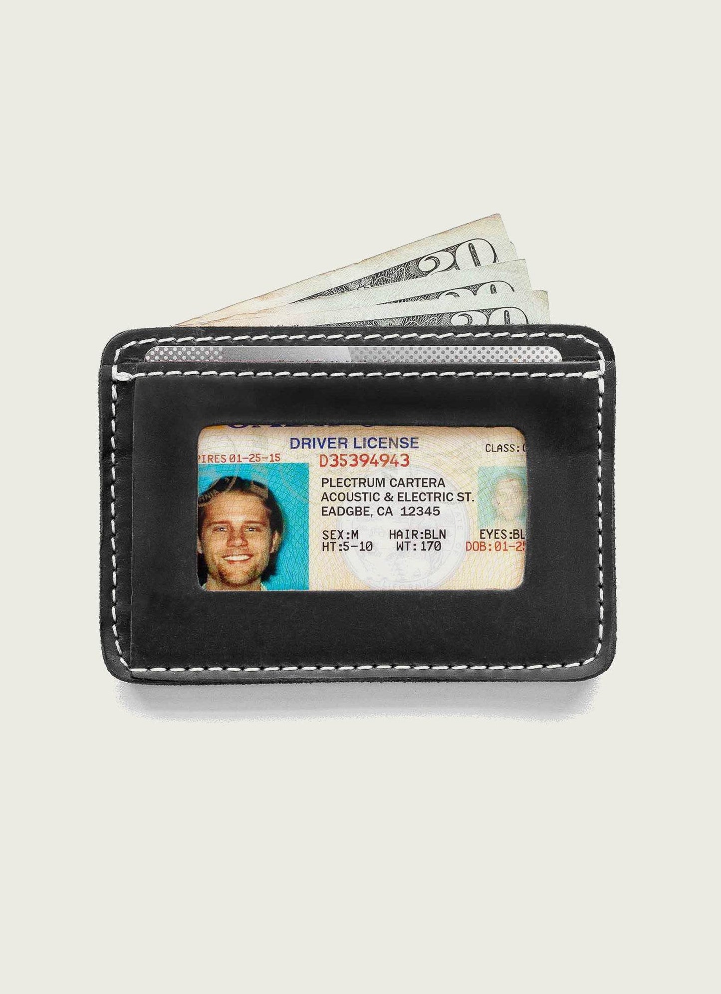 Men's black leather wallet with visible ID and cash, minimalist accessory for everyday carry