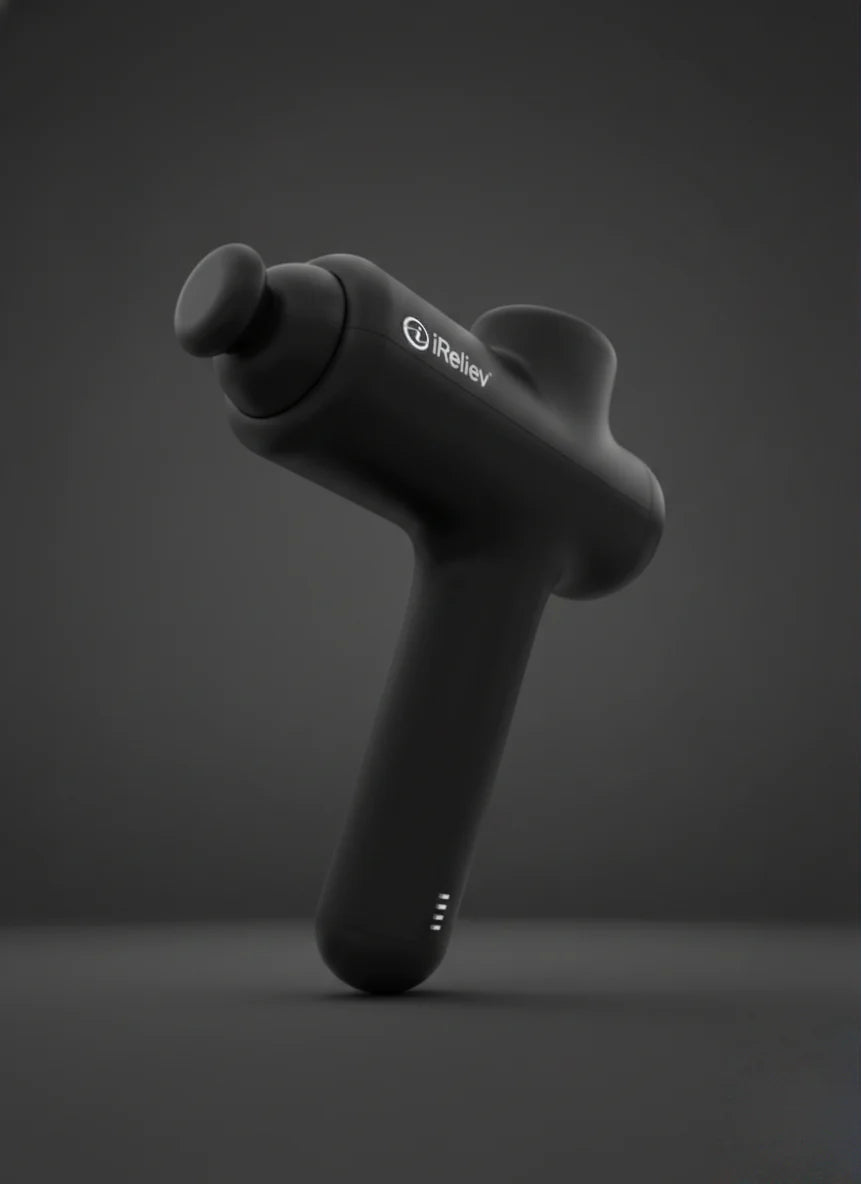 Black iReliev handheld massage gun for muscle recovery on dark background