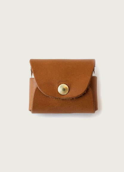 Men's brown leather wallet with gold button closure on plain background