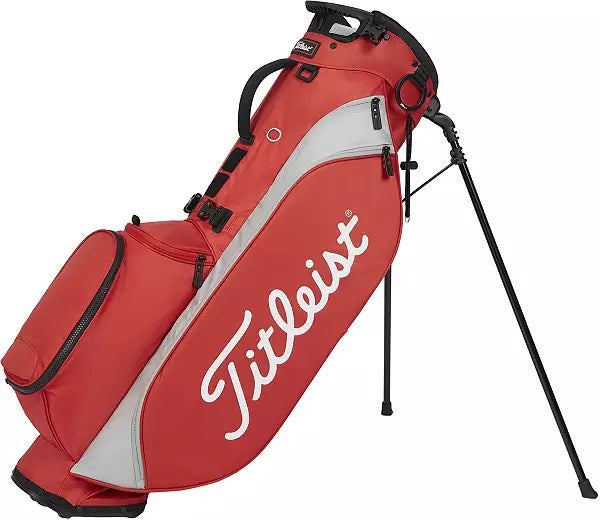 Red and gray Titleist golf bag with stand, men's sports gear on white background