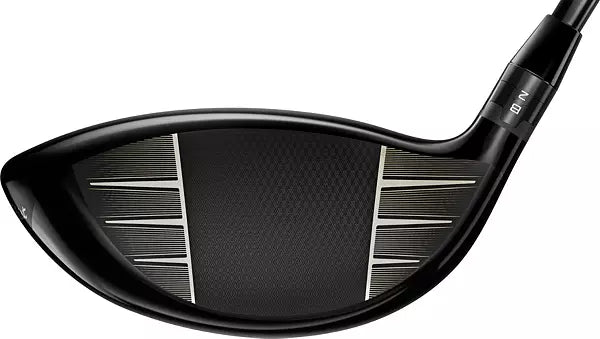 Close-up of a black golf driver club head with textured face, men's lifestyle accessory