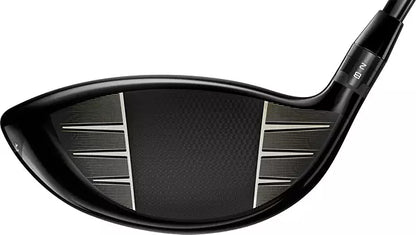 Close-up of a black golf driver club head with textured face, men's lifestyle accessory