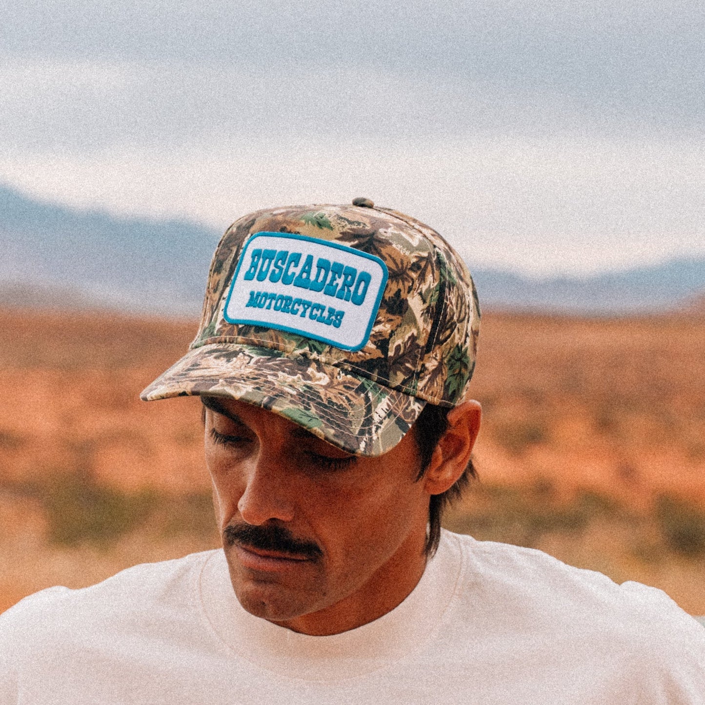 Buscadero Motorcycles 'Blue Barrel' 5 Panel Mid Profile Mesh Trucker Hat - Camo