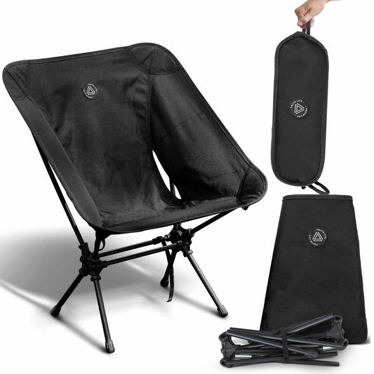 Low back ultralight black folding camping chair with storage pouch, durable and portable design suitable for outdoor adventures.