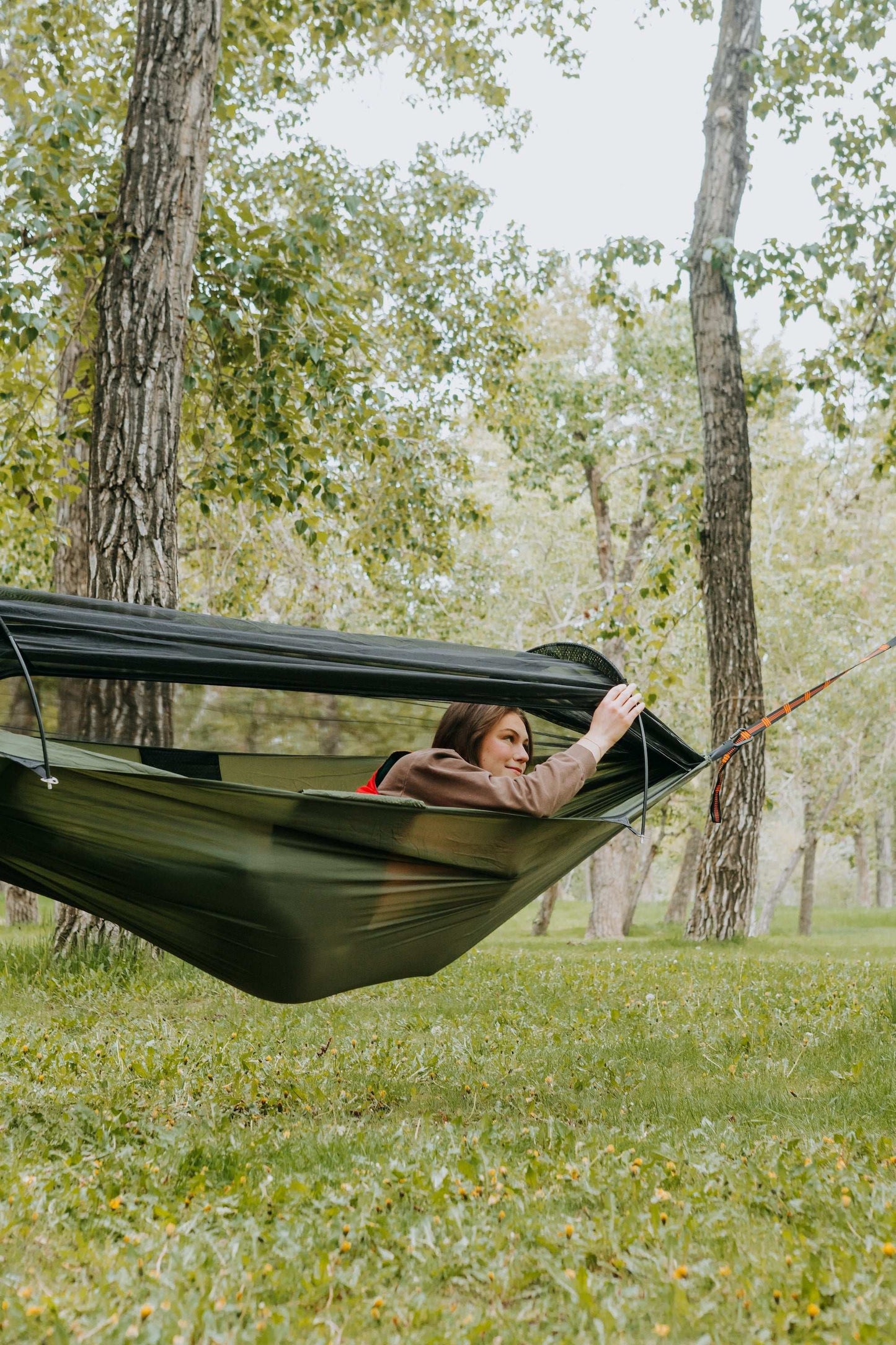 Lightweight hammock with mosquito net for outdoor adventures.