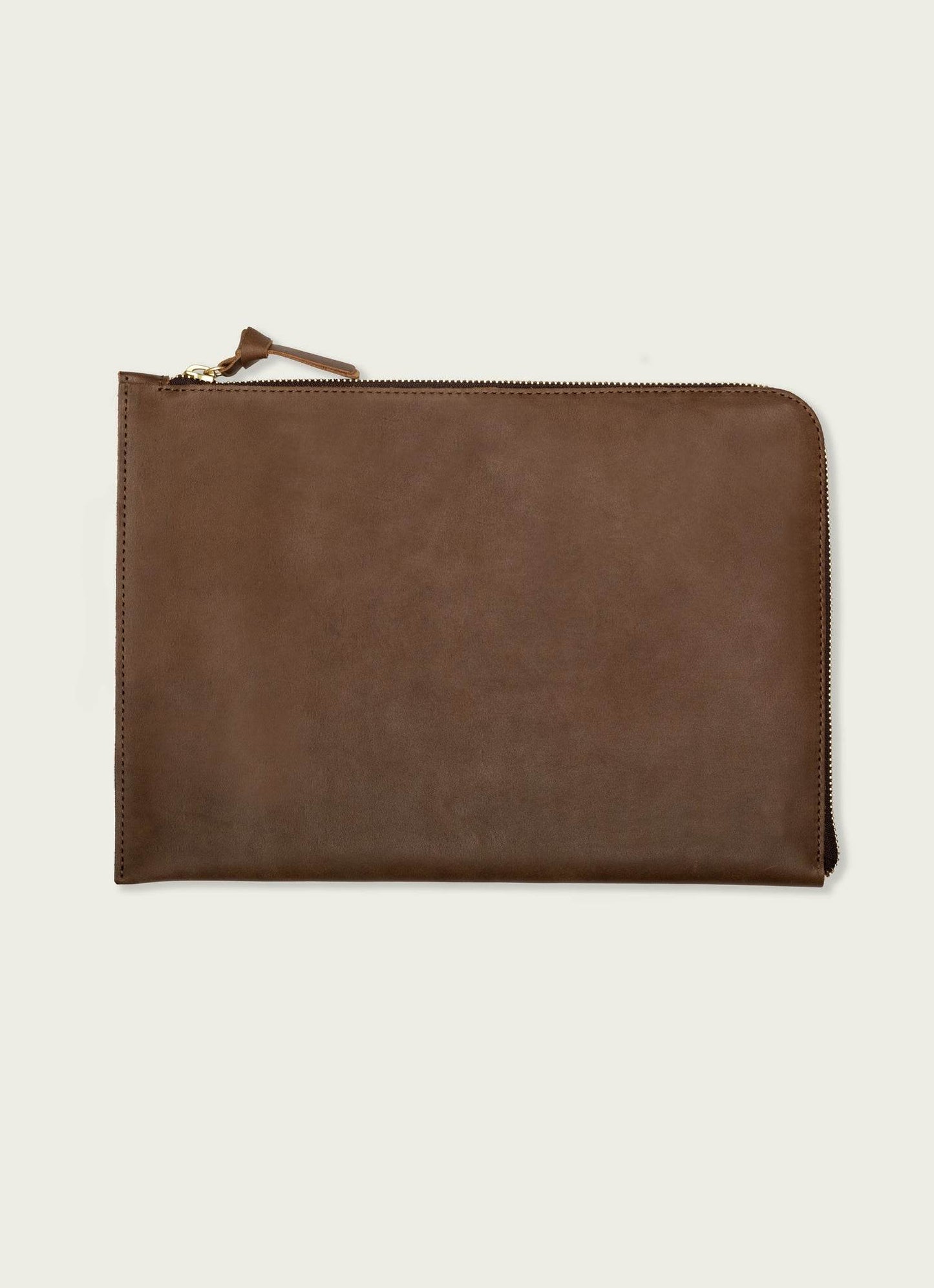 Brown leather laptop case with zipper on neutral background, men's fashion accessory