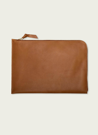 Tan leather laptop case with zipper, minimalist men's accessory on neutral background