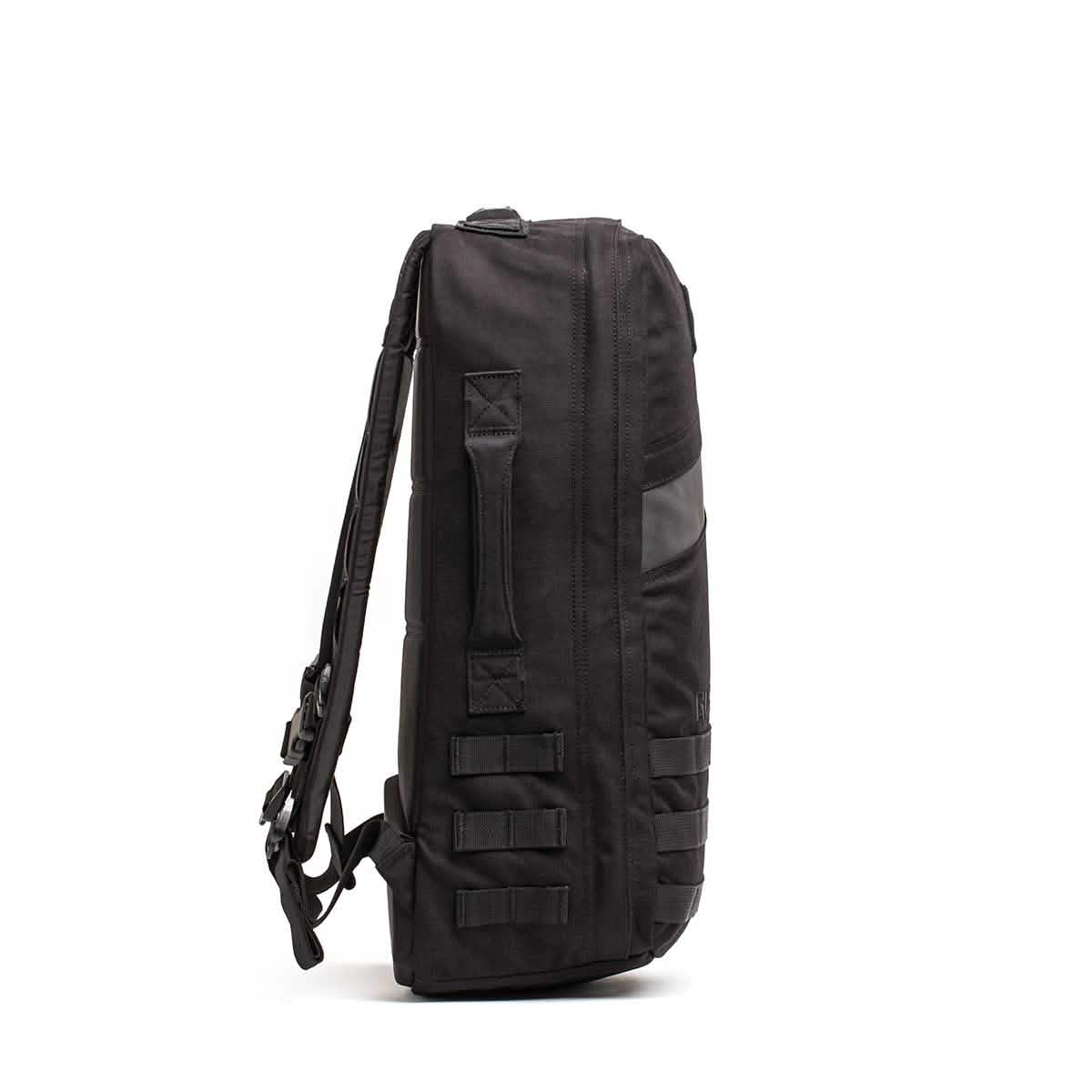 Men's black tactical backpack with side handle and webbing, minimalist background