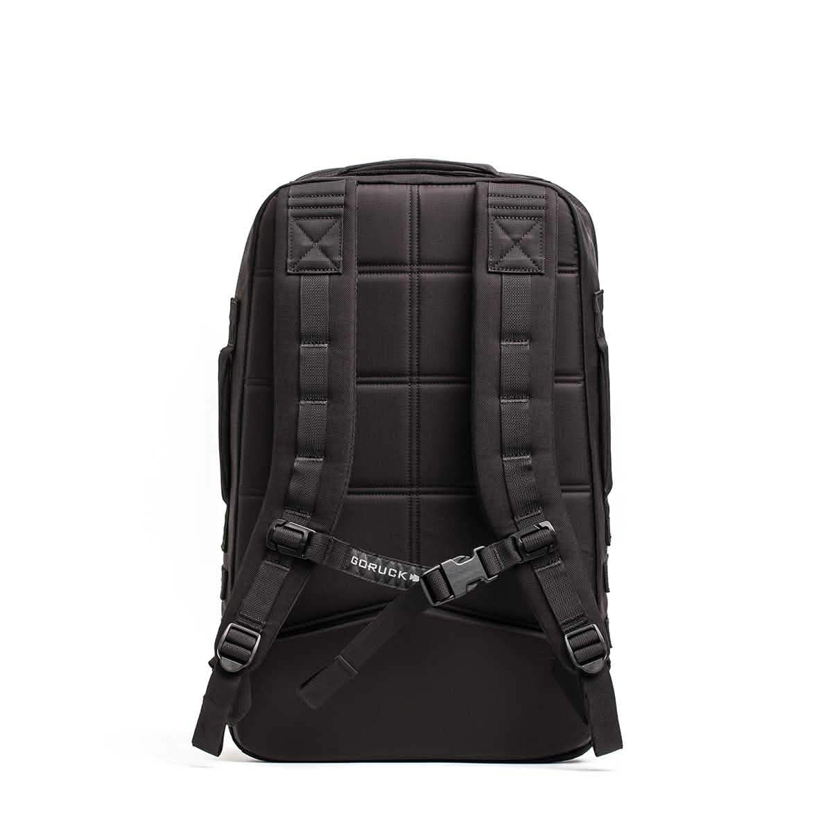 Men's black tactical backpack with padded straps and chest buckle, ideal for travel and lifestyle