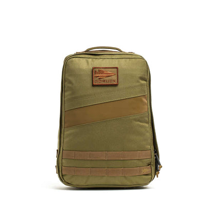 Olive green GORUCK 15L backpack with top handle and front patch, on white background