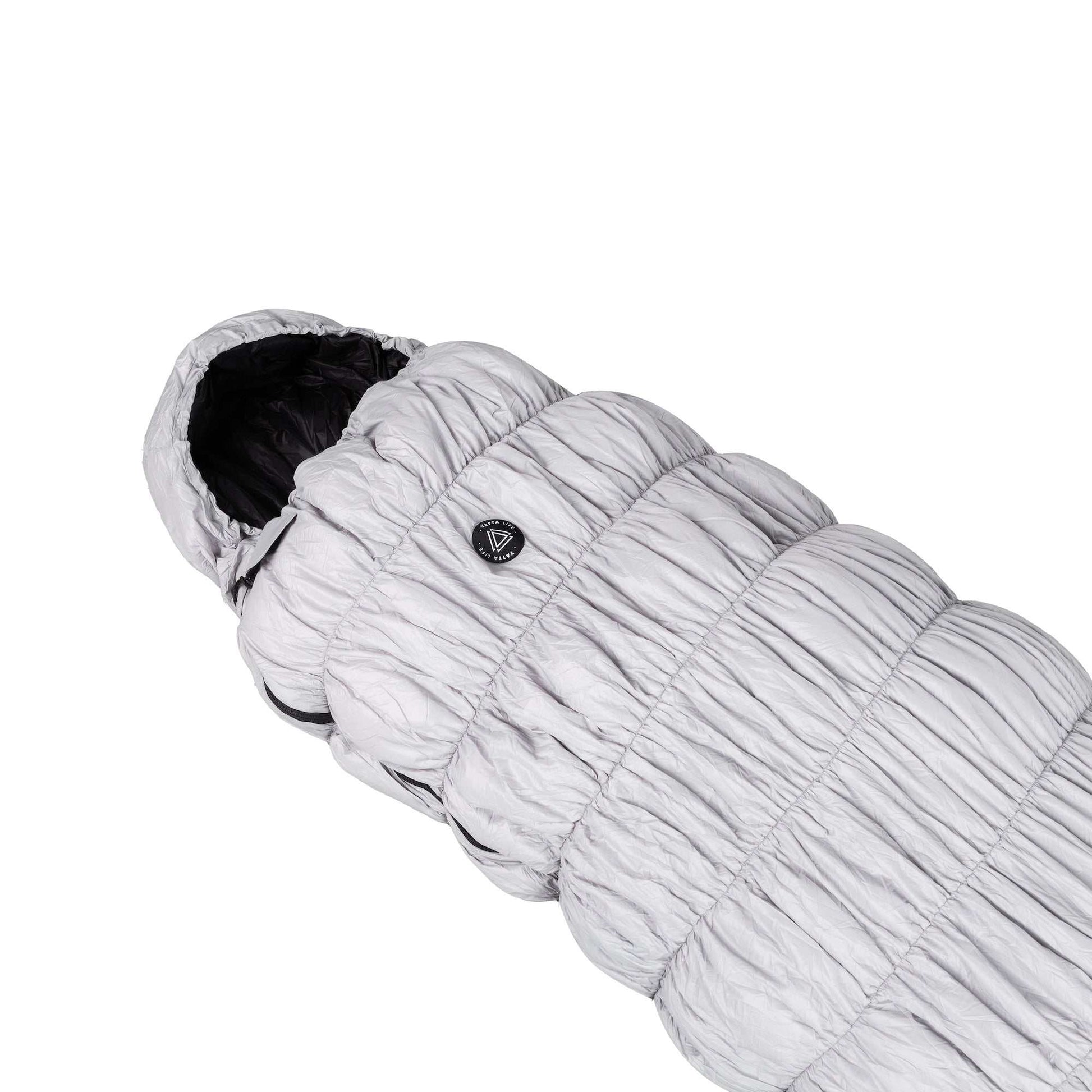 Grey goose down sleeping bag for outdoor use, lightweight, waterproof, and suitable for all seasons.