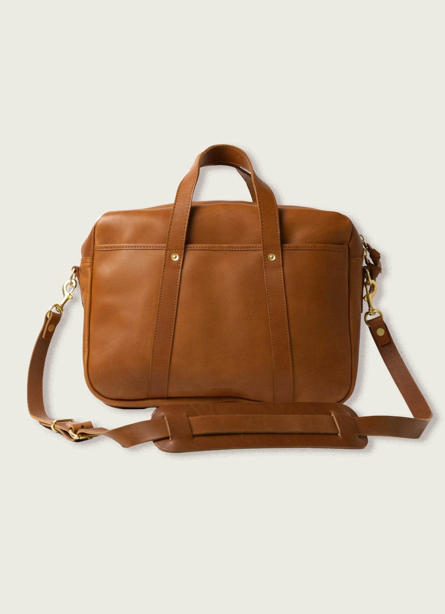 Men's brown leather briefcase with shoulder strap, featured on MANN men's lifestyle marketplace