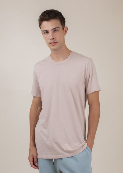 Man wearing apricot basic tee and light blue pants, minimalist men's fashion from MANN