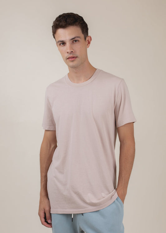 Man wearing apricot basic tee and light blue pants, minimalist men's fashion from MANN