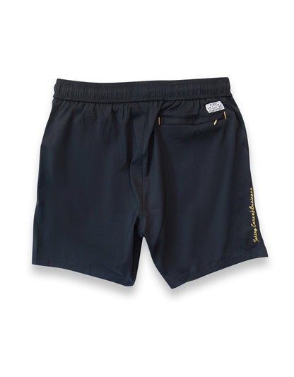 Men's black swimsuit. 6 inch stretch volley trunks. Gold finishes. Functional zipper pockets with internal stash pocket.