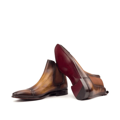 Two brown leather Caratacos Patina Chelsea Boots II showcasing elegant design