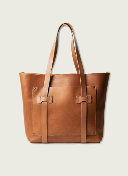 Men’s tan leather tote bag with double straps against a light background, stylish accessory