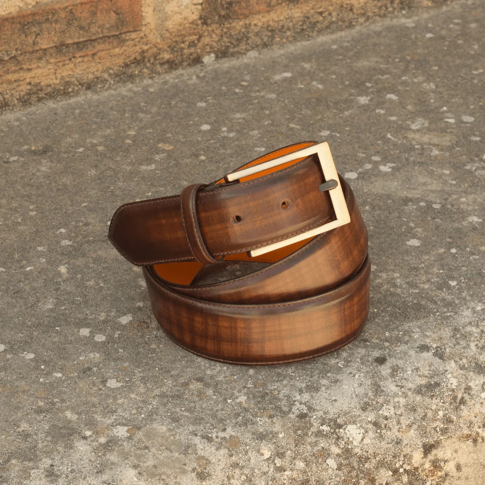 Brown leather Cheung Hampton Belt II featuring a stylish gold buckle