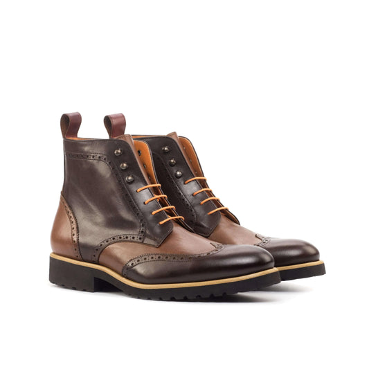 Brown leather wingtip boots in the CL89 Military Brogue design, crafted from brown painted calf
