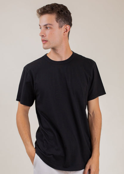 Man wearing classic black tee, casual men's fashion, neutral background, MANN marketplace