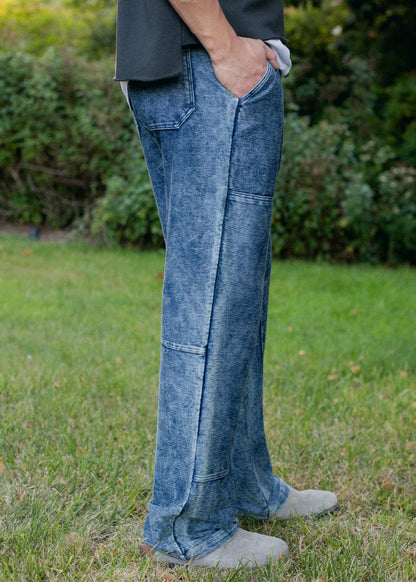 Men's indigo patchwork denim trousers with relaxed fit, outdoor fashion from MANN