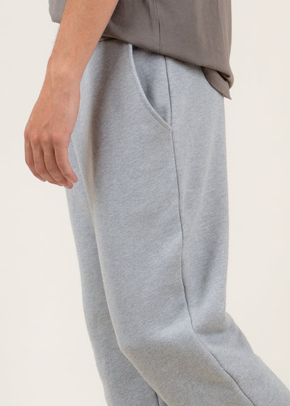 Men's light grey sweatpants with side pockets, casual loungewear fashion on MANN