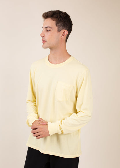 Man in yellow long sleeve pocket tee, stylish men's fashion at MANN marketplace