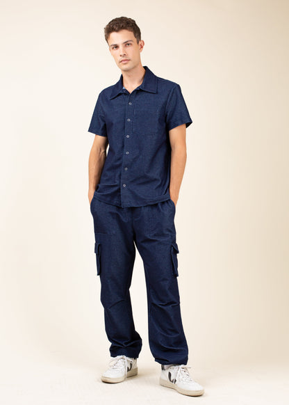 Man modeling navy short sleeve button-up shirt and cargo pants, casual men's fashion