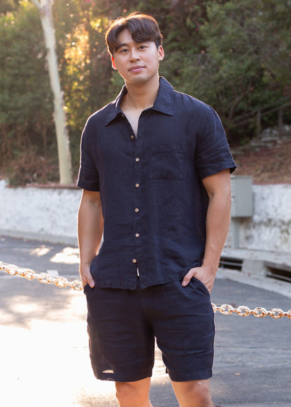 Man wearing a midnight blue linen shirt and shorts set outdoors, summer men's fashion