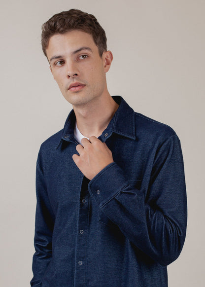 Man in indigo button-down shirt, modern men's fashion style, MANN marketplace