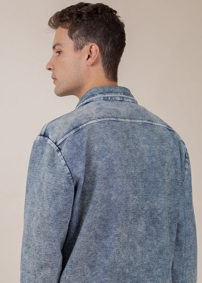 Man wearing indigo mineral wash button-down shirt, back detail, Mann men's fashion