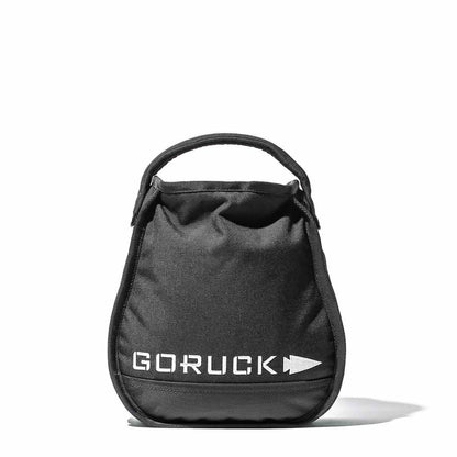 Black GORUCK sandbag with handle, men's fitness gear, isolated on white background.